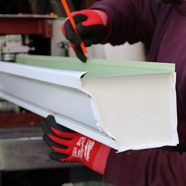 A man doing Debris falling gutter guards