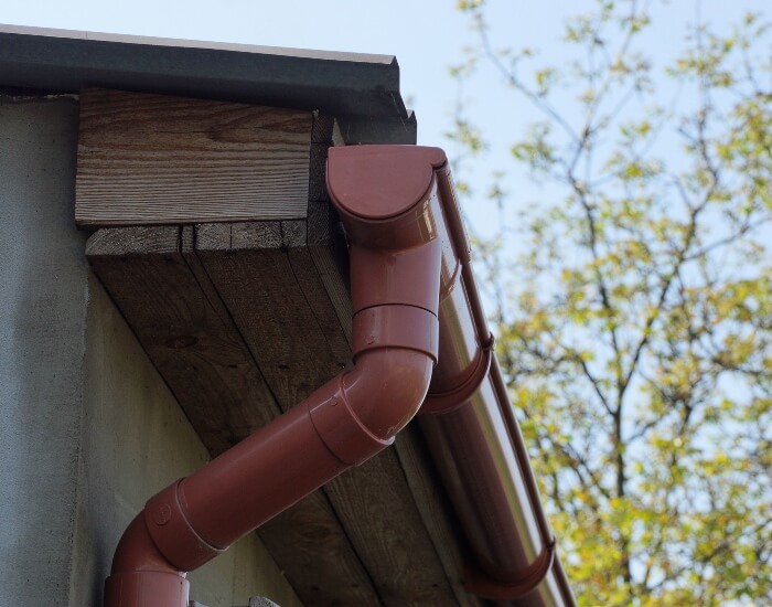 Red gutter and downspout in Snohomish or King County