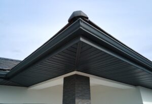 Black aluminum gutters on a corner of a home in Seattle, WA