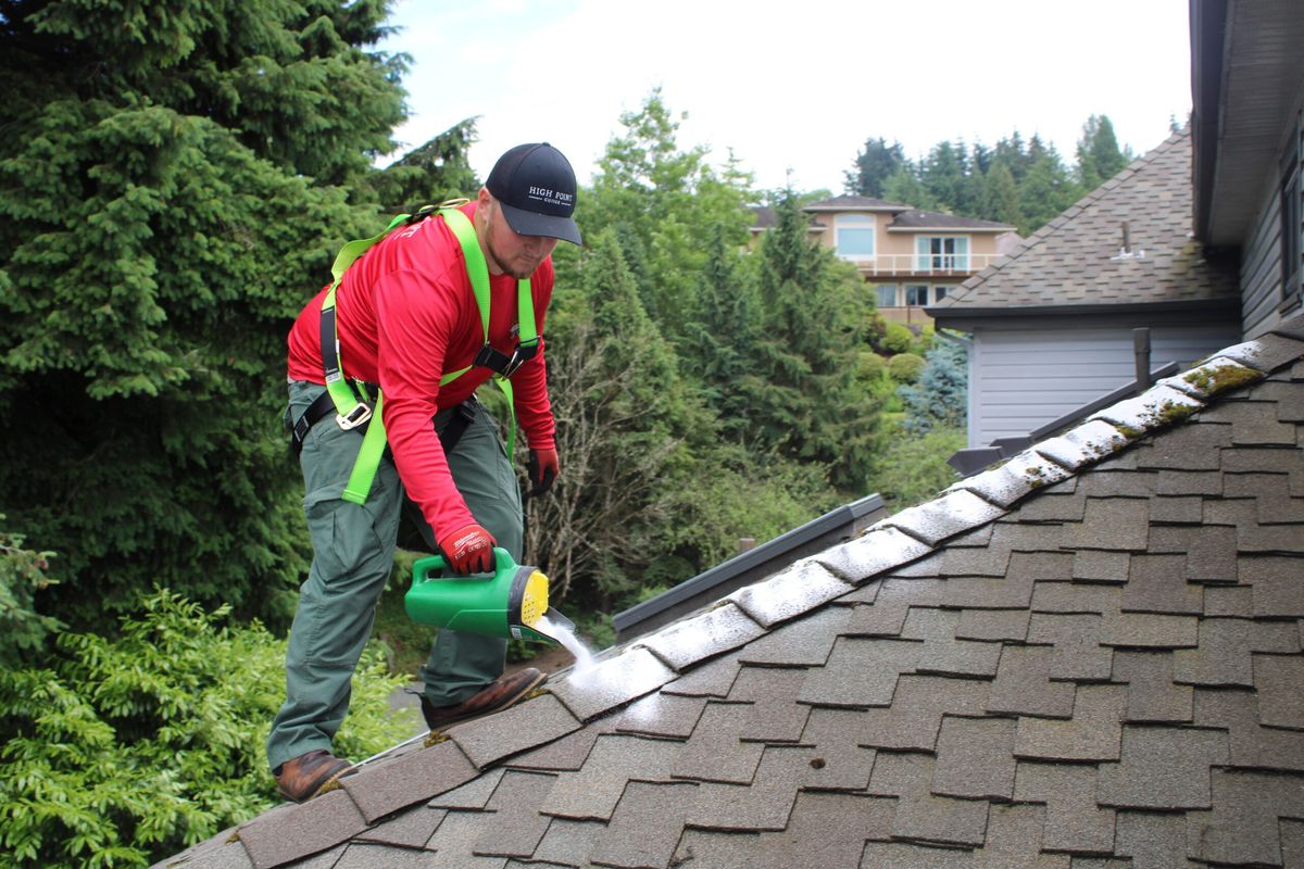 High Point Gutter technician on a Seattle home